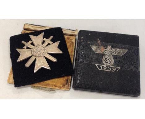 A NAZI WAR MERIT CROSS, impressed mark in pin "L15". In a leather box. Notice: No historical Nazi items are guaranteed to be 