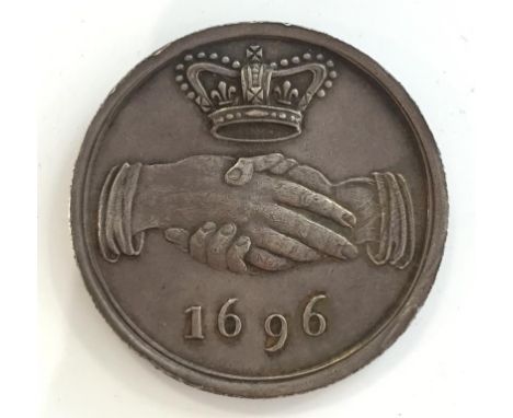 AN AMICABLE SOCIETY SILVER "HAND IN HAND" MEDAL / TICKET, circular with two hands clasped between the Royal Crown and '1696',