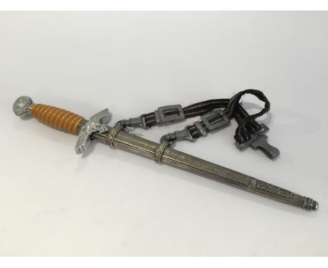 A SECOND WORLD WAR AND LATER NAZI LUFTWAFFE DAGGER, with bakelite grip and suspension strap.