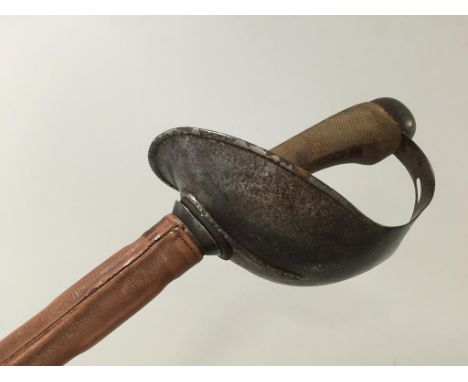 A CAVALRY OFFICERS SWORD with a Wilkinson blade and leather scabbard.