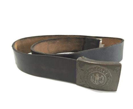 A NAZI BELT WITH METAL BUCKLE, on a leather strap, impressed marks. Notice: No historical Nazi items are guaranteed to be gen