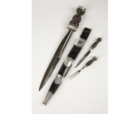 A SCOTTISH DIRK, with a leather and silver plated mounted scabbard, and a carved wood grips, 19th century, 18".