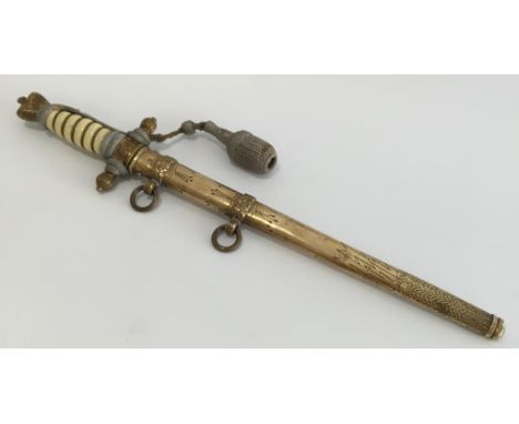 A SECOND WORLD WAR NAZI NAVAL DAGGER, with engraved blade and scabbard.