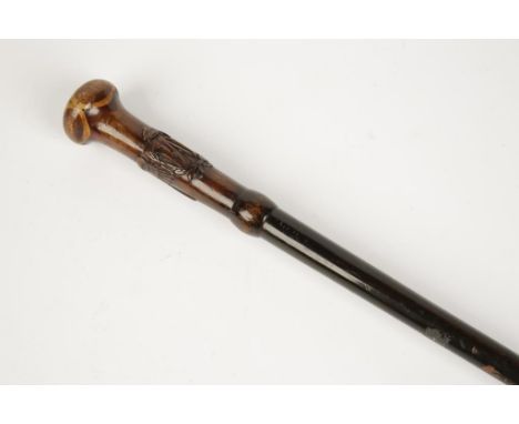 A CARVED WOOD RAF SWAGGER/WALKING STICK, 34".