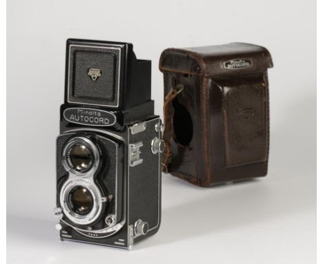 A MINOLTA AUTOCORD CAMERA, with Minolta Rokkor F3.5/75 and F3.2/75 lenses. In leather case with strap.