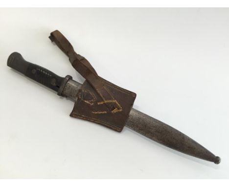 A SECOND WORLD WAR BAYONET, with scabbard and leather frog.