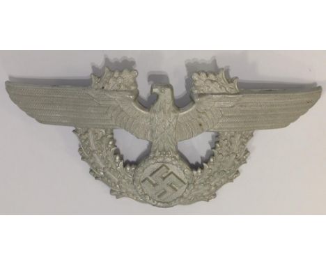 A NAZI METAL CAP BADGE, impressed mark. Notice: No historical Nazi items are guaranteed to be genuine, we ask buyers to come 
