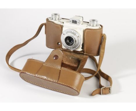 AN ILFORD ADVOCATE CAMERA, ivory enamel body, with a Dallmeyer F3.5/35 lens, serial no. 445075. In a leather case with strap.