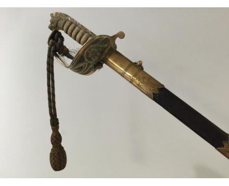 A GEORGE V NAVAL OFFICERS SWORD, with engraved blade and leather scabbard, with suspension belt.