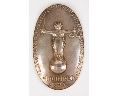 A WHITE METAL LAW UNION AND CROWN INSURANCE COMPANY MESSENGER'S BADGE, oval with a justice in the centre standing on a globe,