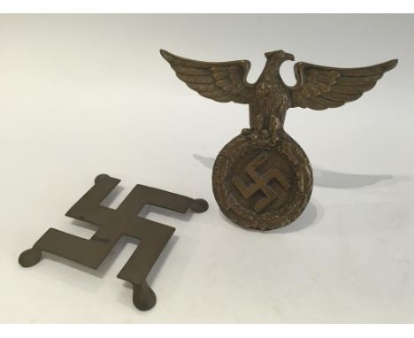 A NAZI METAL DESK STAND, and a swastika trivet. (2) Notice: No historical Nazi items are guaranteed to be genuine, we ask buy