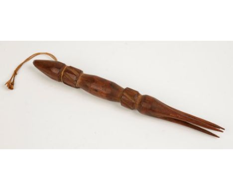 A CARVED WOOD CANNIBAL FORK, with three prongs, probably 19th century, 11.5".