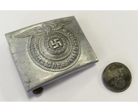 A NAZI METAL BELT BUCKLE, impressed marks. Notice: No historical Nazi items are guaranteed to be genuine, we ask buyers to co