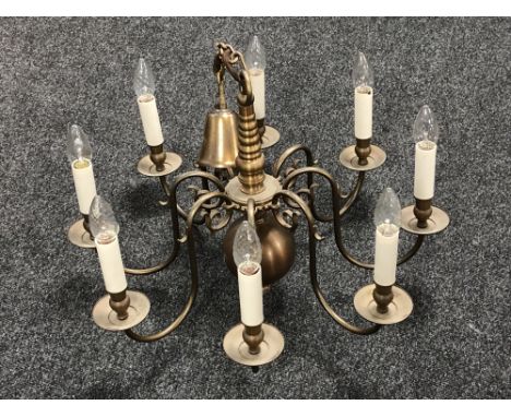 A Continental eight branch metal chandelier
