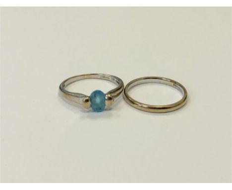 A 9ct gold blue topaz ring and a 9ct gold band ring. (2) CONDITION REPORT: 4.1g gross. 