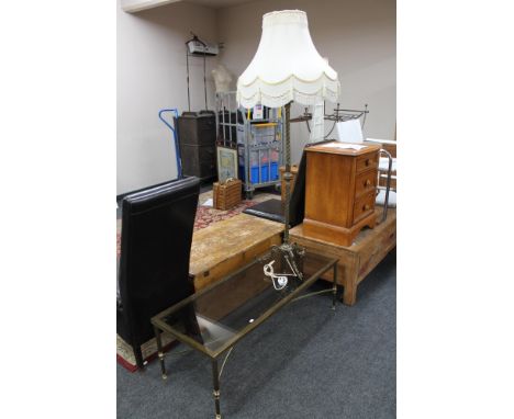 A brass and glass topped coffee table together with a brass standard lamp and shade 