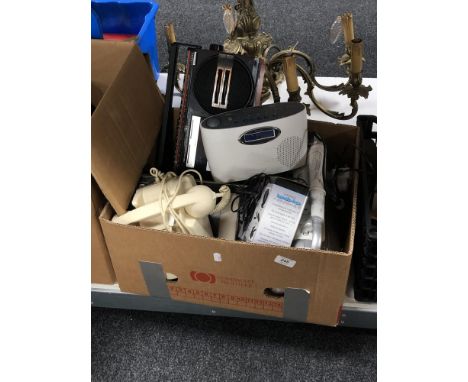 A box of electricals, hands free kit, two radios, telephone hand set, Casio answering machine etc 