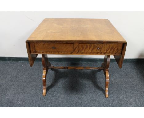 A nineteenth century mahogany flap sided sofa table CONDITION REPORT: Small loss to edge to one of the flap sides where it jo