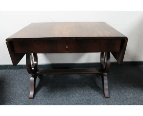 A mahogany flap sided sofa table fitted a drawer 