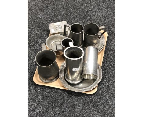 A tray of pewter tankards, lidded trinket box, shallow dishes etc 