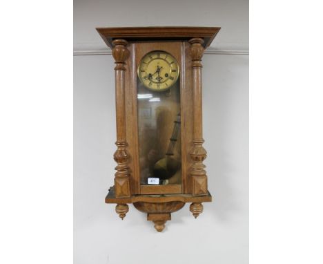 A continental oak cased eight day wall clock