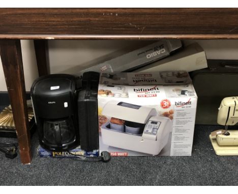 A boxed bread maker, Krups coffee maker, boxed drill, Casio keyboard 