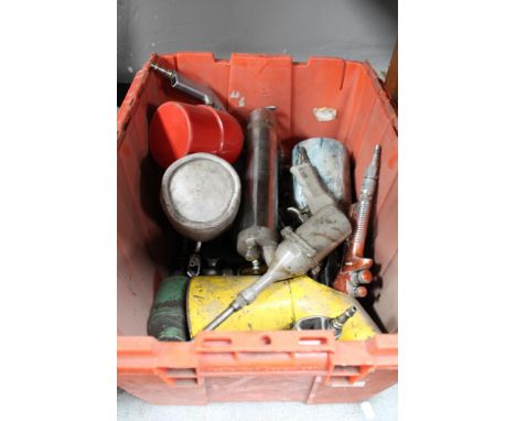 A box of various commercial spray tools