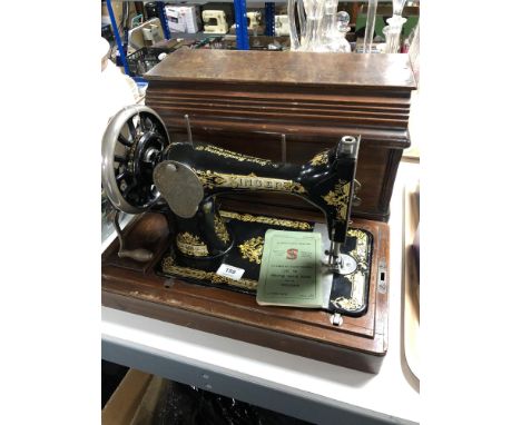 A cased vintage Singer hand sewing machine 