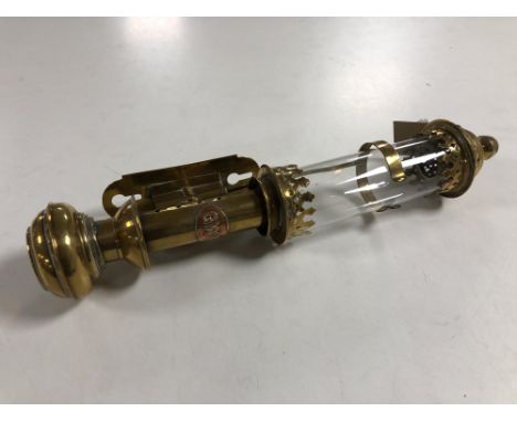 A vintage brass GWR wall mounted oil lamp