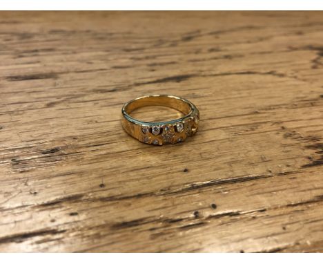 An 18ct gold diamond set ring