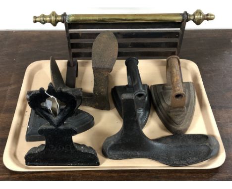 A tray of cast iron door stop, vintage irons, cobblers last, shoe stretcher etc 