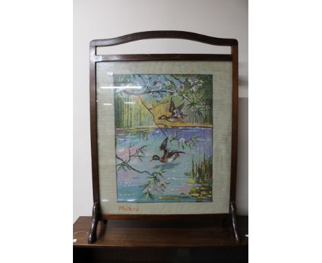 A tapestry fire screen 