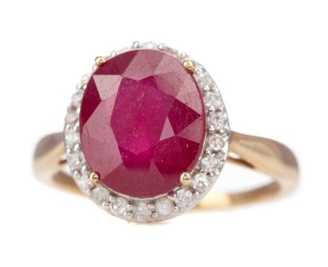 RUBY AND GEM SET CLUSTER RING, set with an oval ruby within a halo of round white gems, marked 9K, size R 1/2, 4.8gLightly wo