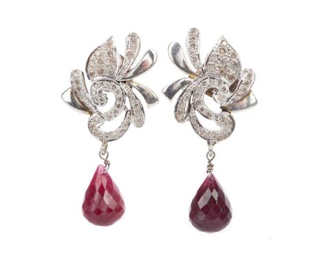 PAIR OF RUBY AND DIAMOND EARRINGS,the ornate white metal mounts set with round brilliant cut diamonds, each with a suspended 