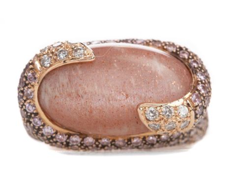 GEM SET RING,set with a cabochon hardstone to a pink gem set mount with diamond set terminals, in eighteen carat rose gold, s