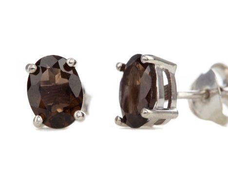 PAIR OF SMOKY QUARTZ STUD EARRINGS,set with oval stones, in silver