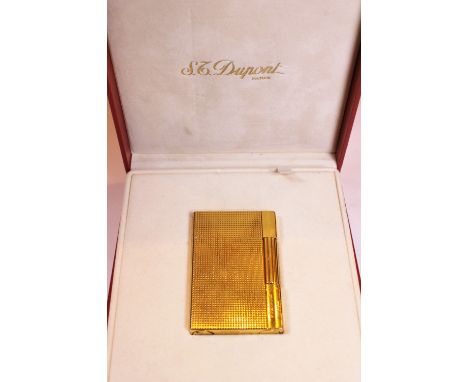 ST DUPONT LIGHTER. Boxed gold plated St Dupont lighter with paperwork