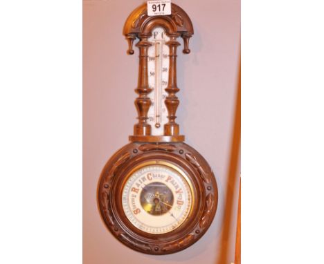 ANEROID BAROMETER THERMOMETER. Antique aneroid barometer thermometer with carved wood frame