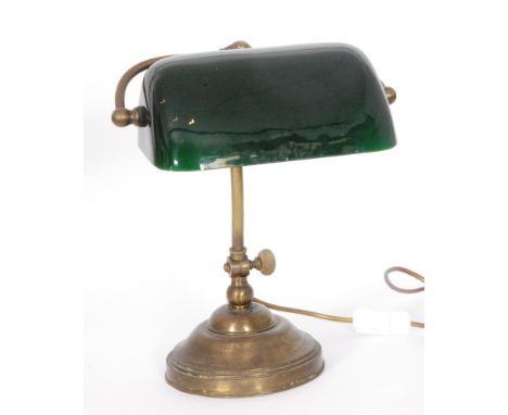 A 20th Century bankers lamp and shade with adjustable column on a circular base, height 36cm