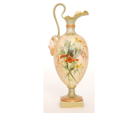 A Royal Worcester blush ivory shape 1144 pedestal ewer decorated with an enamel spray of thistles and flowers against the pal