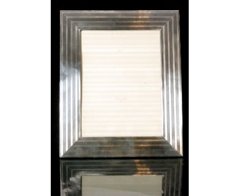A George V hallmarked silver rectangular photograph frame with engine turned decoration to a wooden easel back, height 28cm, 