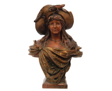 A large early 20th Century terracotta bust entitled L'automne (Autumn) in the Goldscheider style, modelled as a maiden draped