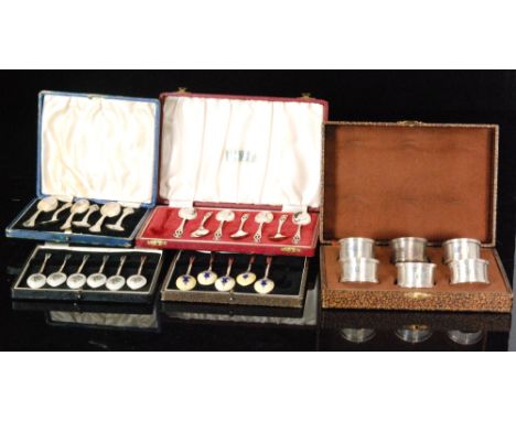 A set of six hallmarked silver and guilloche floral enamelled teaspoons, Birmingham 1957, another part set of enamelled teasp