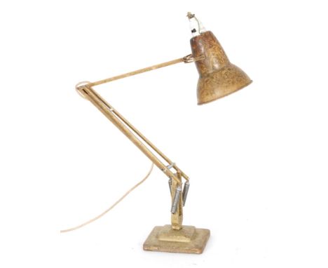 A 1930s Anglepoise lamp with conical shade on square base.