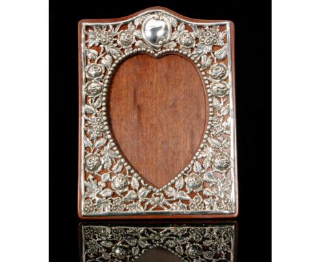 An Edwardian hallmarked silver mounted easel back photograph frame of rectangular outline, the wooden mount with applied pier
