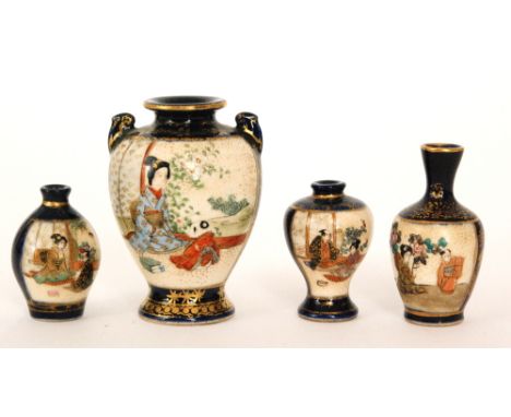 Four late 19th Century Japanese miniature vases each panel decorated with figures sat in gardens, flanked by blue borders wit