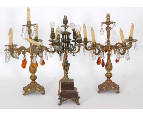 A pair of gilt metal six light candelabra with scroll bases and crystal droppers, height 44cm, together with a late 19th Cent