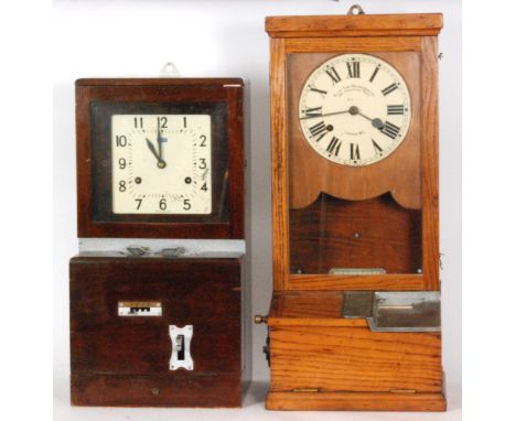 A 1930s oak cased Blick Time Recorder machine London W.C, height 83cm and a similar mahogany cased machine with square dial i