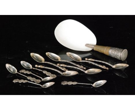 A Chinese rice spoon with bamboo decoration and shell bowl, six similar teaspoons each with figural terminal and five further