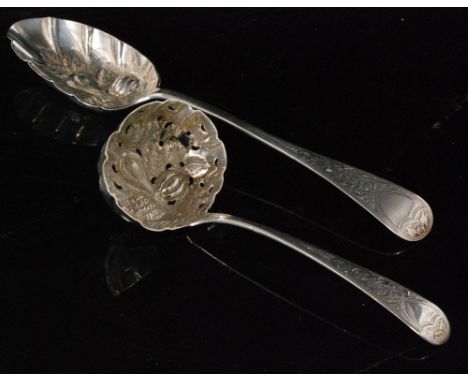 A hallmarked silver old English pattern berry spoon Sheffield 1896 with a similar sifting spoon with later decoration, London